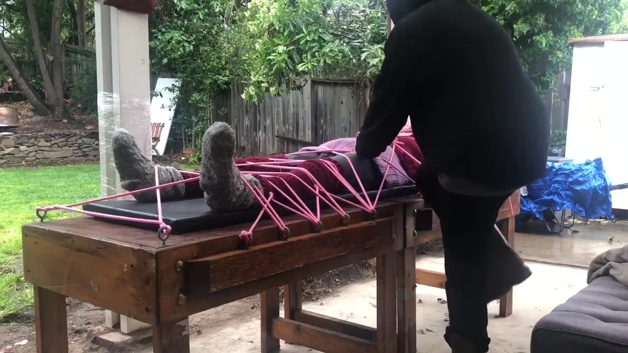 Wool Mohair Layers Of Sweaters On A Bondage Table
